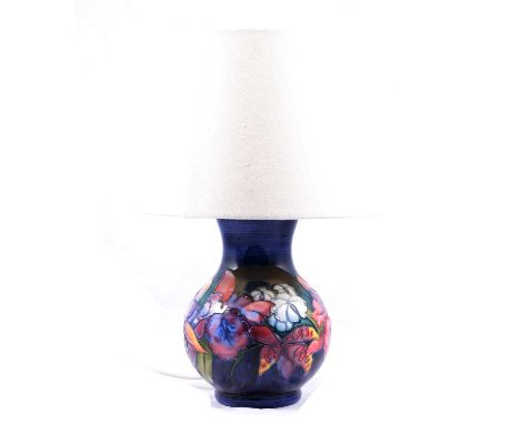 Moorcroft Pottery lamp base, 'Orchid' design, circa 1950s, white silk shade, height of lamp base (minus the shade) 21cm.Condi