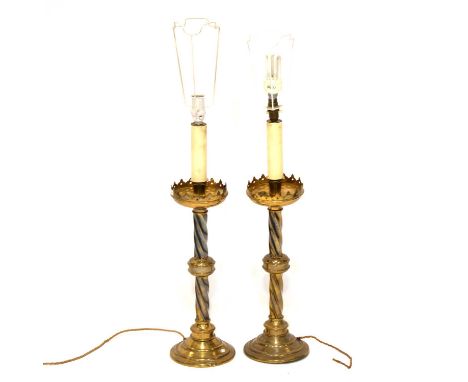 Pair of Ecclesiastical brass candlesticks, converted to lamps, height of candlestick section 50cm, and two other table lamps.