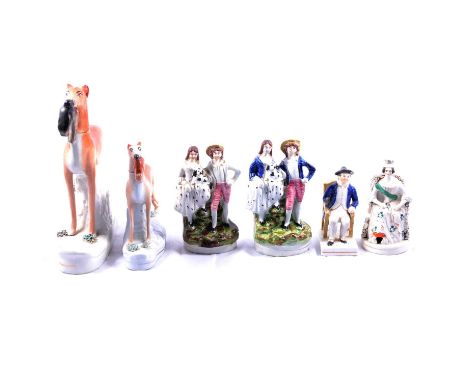 Eight 19th century Staffordshire ceramic figures including a large and a small pair of Staffordshire Greyhounds with Hares, 2