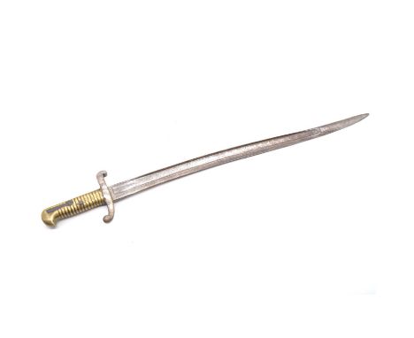 A French Chassepot bayonet with ribbed brass grip handle, fullered steel blade, no apparent markings, length 69cm, lacking sc