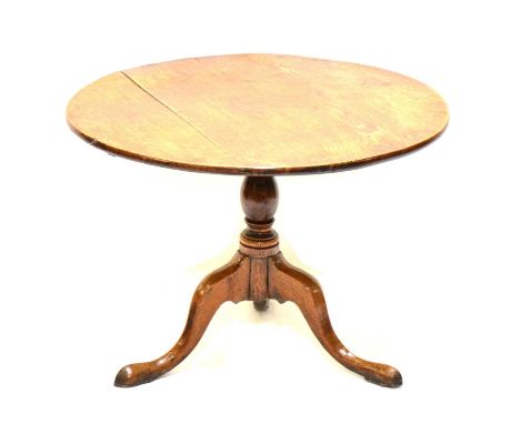 George III oak tripod table, circular tilt top, reduced column, splayed legs, diameter 81cm, height 57cm.