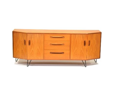 G-Plan teak sideboard, with cantered ends, with three central drawers flanked by cupboards, raised on steel framed supports, 