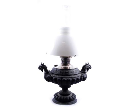 Victorian cast metal oil lamp, opaque glass shade upheld on a chromed reservoir, housed on a classical style base cast with t
