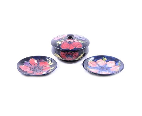 Collection of six Moorcroft Pottery 'Anemone' pattern items including ovoid vase, 18cm; candlestick, 21cm; table clock (2nd q