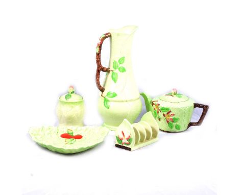 A collection of CarltonWare Apple Blossom ceramics, to include milk jugs, toast rack, butter dish, egg cups with tray, vegeta