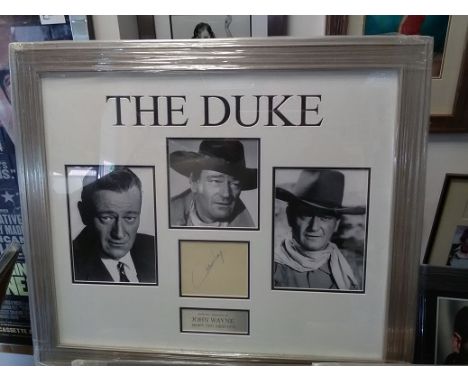 John Wayne signed autograph display. Signed album page mounted to high standard with three individual portrait photos. Overal