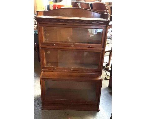 A 20th century three section Globe Wernickestyle bookcase, the brass labels embossed "The Lebus Bookcase", 138cm high, 88cm l