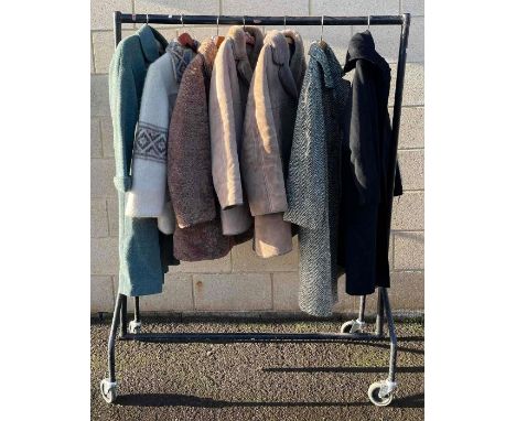 A collection of ladies vintage coats, to include two camel coats, a mixed green Harris Tweed 100% wool coat, an Ellen Jay of 