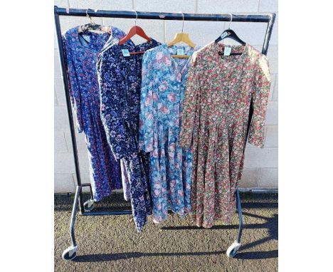 Four vintage floral Laura Ashley dresses, all full length with long sleeves and all UK size 16