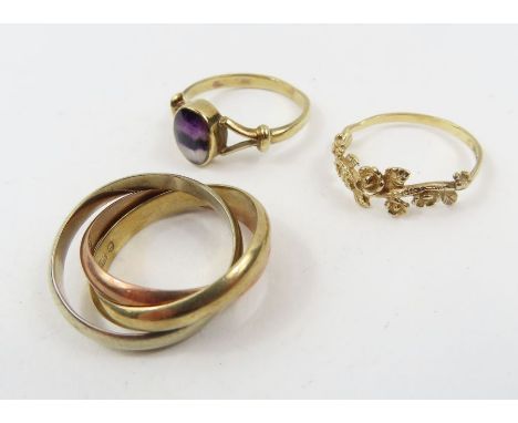 A 9ct gold Blue John set ring, finger size M; a 9ct gold ring with floral cut out decoration, finger size K 1/2;  and a 9ct t