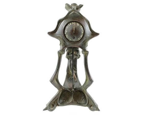 An Art Nouveau stylised spelter clock, 47cm high 