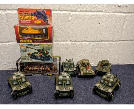 Model tanks and armoured vehicles to include a tin plate tanks, a boxed Military Force King Tiger tank, a boxed battery opera