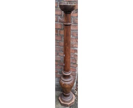 A vintage teak pricket stand having a turned column and on an octagonal base, 139.5h x 20wLocation: RCONIf there is no condit