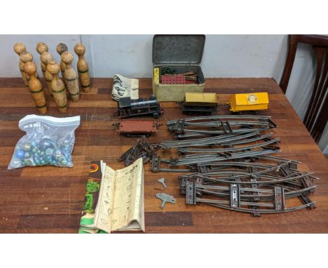 A collection of vintage toys to include a Hornby 0 gauge part train set with engine A/F, a set of skittles, Meccano items and