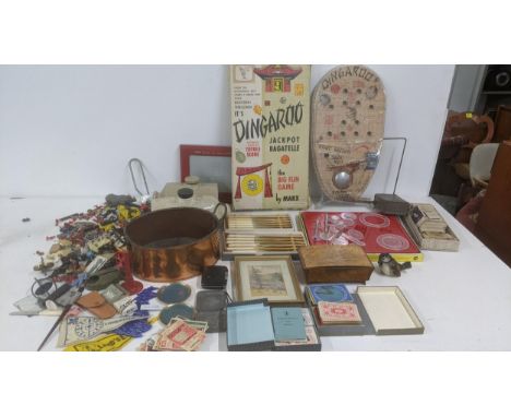 A mixed lot of toys and others to include Dingaroo by Marx, silver plated cutlery, vintage spinning tops, a West German ceram