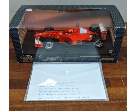 A 1:18 scale Hotwheels Racing boxed diecast model Ferrari F1-2000 signed by Michael Schumacher Location: If there is no condi