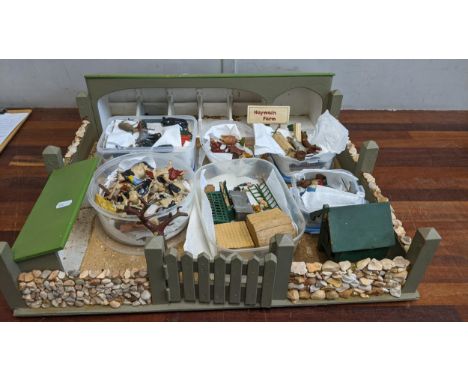 A homemade model farmyard titled Haywain Farm, along with various miniature farm animals, miniature equipment some marked W M