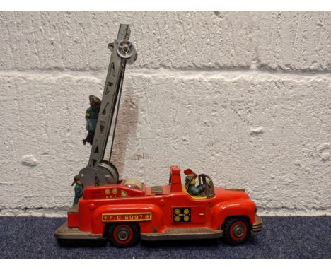 A mid 20th century tin plate, battery operated fire engine, FD 6097Location:If there is no condition report, please advise