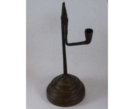 WROUGHT IRON RUSH LIGHT ON TURNED WOODEN BASE
