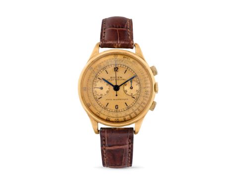 Rolex 3834 chronograph retailed by Giudici, 40s18k gold round case, n.77152, rectangular pushers.Champagne dial, multi-scale,