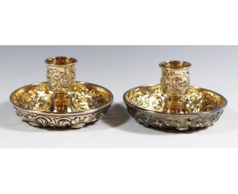 A Sterling Silver Twin Candlestick Travelling Set with embossed foliate scroll decoration and gilt lined interior, 88mm diam.
