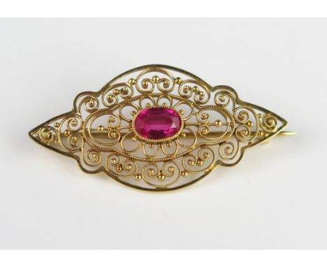 An 18ct Gold and Ruby Brooch, millegrain set, stone 7.2 x 4.5 mm, 3.4 g 