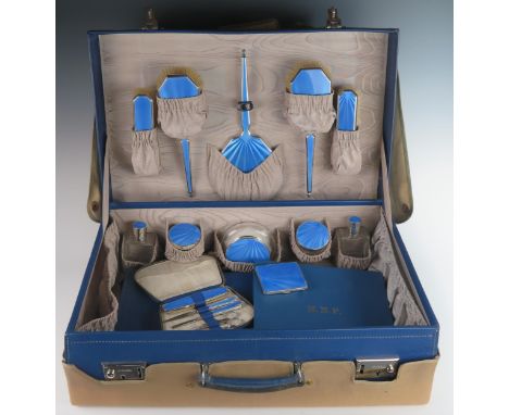 A Superb George V Silver and Blue Guilloché Enamel Travelling Toiletry Set including a six part mirror, brush and comb set, f