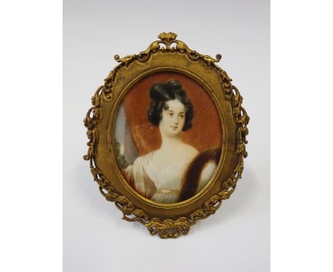 An Early 19th Century Portrait Miniature of a Lady in an easel back gilt metal frame, 12 x 9.5 cm 