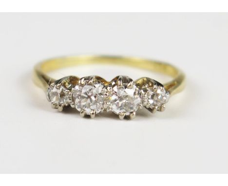 An 18ct Gold and Diamond Four Stone Ring, central stones 4 mm, size L, 2.5 g 