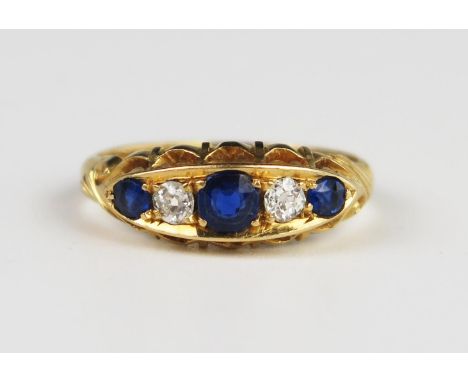 A Victorian Gold, Sapphire and Diamond Five Stone Ring, Chester 1898, size M.5, 3.9 g, central stone 4.1 mm, diamonds 3 mm 