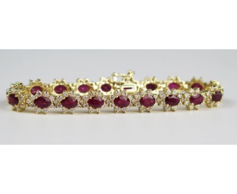 A 7" Ruby and Diamond Bracelet with nineteen 6 x 4 mm rubies, each surrounded by eight 2 mm brilliant round cut diamond (EDW 
