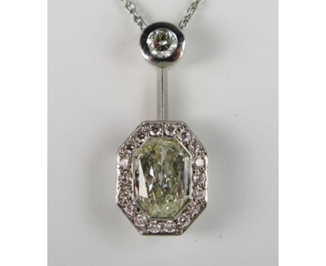 A Modern Platinum and Diamond Pendant Necklace, the central octagonal multi-faceted 2.01ct stone assessed as K/VVS and cluste