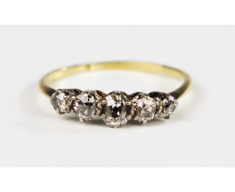 An 18ct Gold and Five Stone Old Cut Diamond Ring, size R.5, 2.3g. Head of ring 17mm, largest stone 4.4mm 