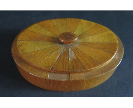 A WWII Prisoner of War Oval Snuff Box made from small pieces of cigar and match boxes, 9 cm, with label indicating it was mad