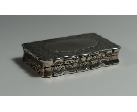 A Victorian Silver Snuff Box with chased foliate decoration, Birmingham 1882, George Unite, 51x33mm, 34g 