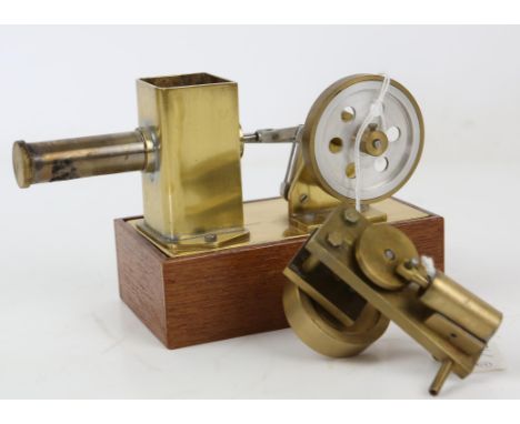 Scratch built brass and steel model of an engine, on wooden base, engine 7.5cm high, 17.5cm long, and an engine part, inscrib