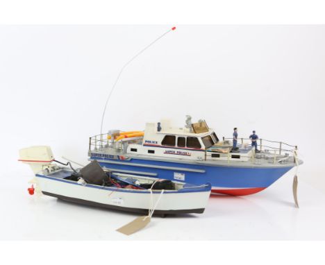 Radio controlled 'Super Police' model patrol boat, 50cm long, and another smaller boat, 45cm long including engine, (2), 