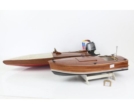 Fibre glass hulled and plywood motor boat, 70cm long including engine, and another smaller, 42cm long, (2),