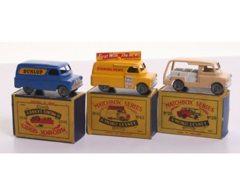 Three Matchbox Moko Lesney Models Bedford Vans, 25a Bedford CA Dunlop Van, dark blue body, silver trim, metal wheels, with a 