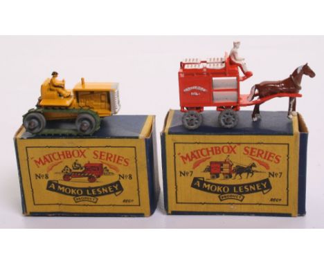  Two Matchbox Moko Lesney Models 7a Horse drawn Milk Float, orange body,white crates/figure, metal wheels, with a excellent B