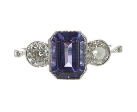 Modern platinum tanzanite and diamond three stone ring, the tanzanite 1.70ct approx, with two round brilliant-cut diamonds to