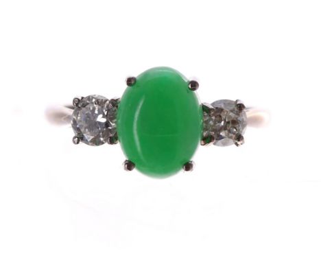 18ct white gold cabouchon jade and diamond three stone ring, the jade 2.20ct approx, with two round brilliant-cut diamonds to