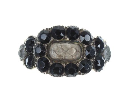William IV yellow metal mourning ring, set with garnets enclosing a plaited hair panel, inscribed verso 'Geo Boswall 5th June
