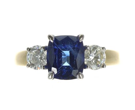 Good quality 18ct bicolour sapphire and diamond three stone ring, the sapphire of good colour 1.90ct approx, with two round b