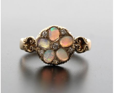 Pretty 18ct opal and diamond cluster ring, with five cabouchon opals and a six small diamonds, 11mm, 3.1gm, ring size O/ 