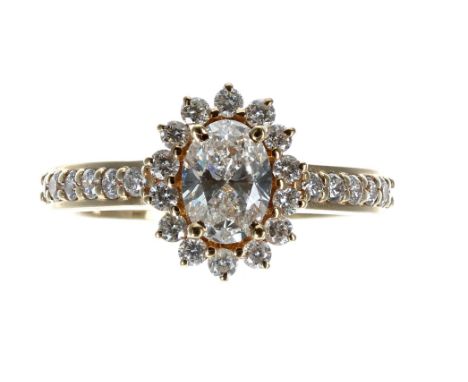 Good quality 18ct yellow gold diamond cluster ring with set shoulders, the centre diamond 0.75ct, clarity VS2, colour E, 12mm