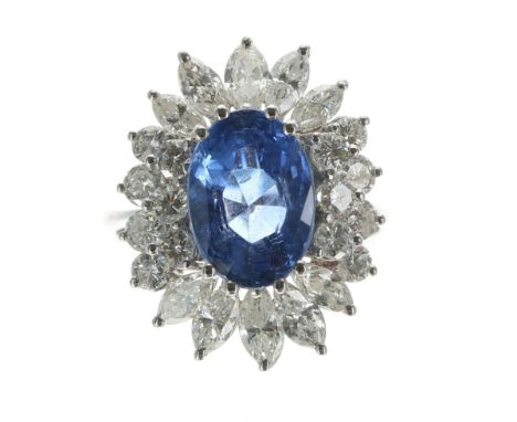 Impressive&nbsp;large white gold sapphire and diamond cluster ring, the sapphire 4.60ct approx, in a setting of marquise and 