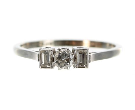 18ct white gold and platinum three stone diamond ring, round brilliant and baguette-cuts, width 4mm, 2.4gm, ring size Q; with