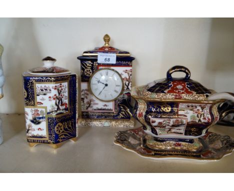 Three pieces of Masons Ironstone Double Landscape pattern to include mantel clock, tureen, stand and ladle, and lidded vase. 