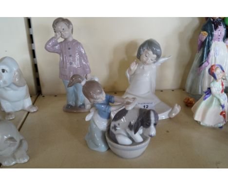 Three assorted Lladro and Nao figurines to include a girl washing her dog, boy holding Teddy bear etc.